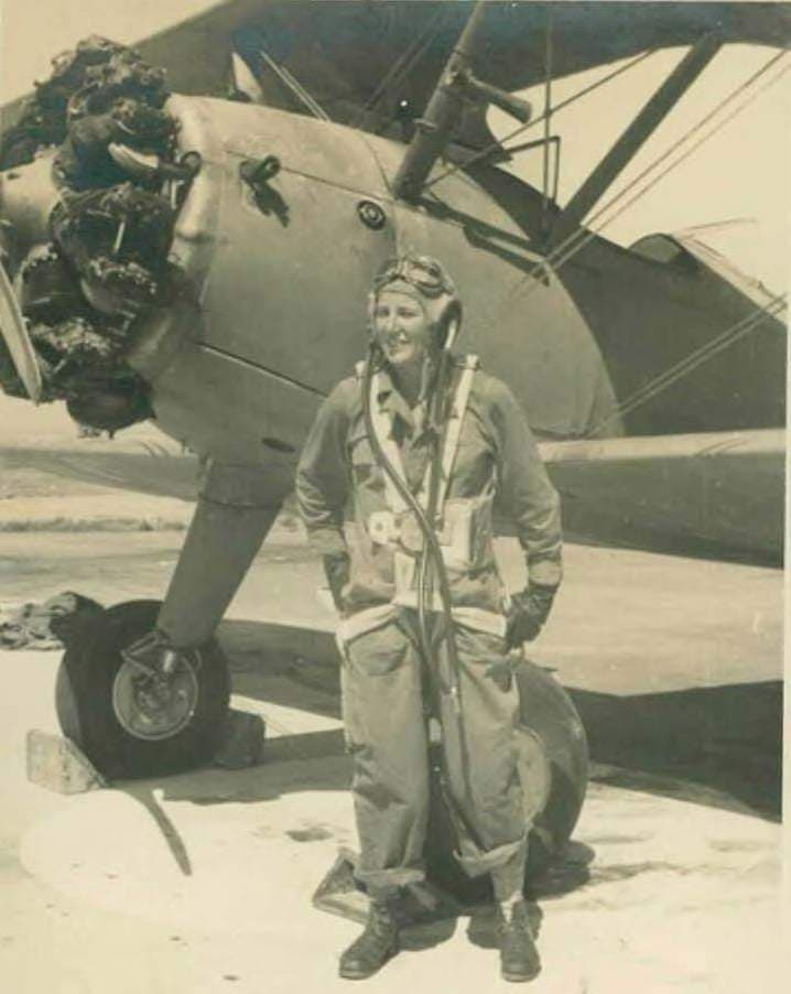 Yael Rom standing next to stearman airplane trainer israeli airforce